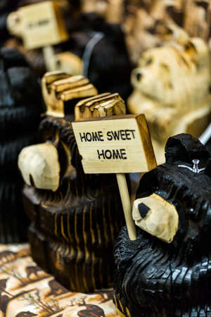 Handmade wood bears for sale at the local craft market.の写真素材