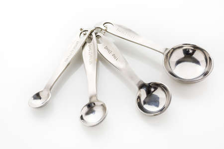 Measuring cups and spoons on the table.の写真素材