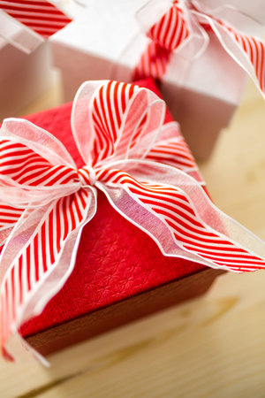 Red and white boxes with Christmas gifts.