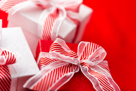 Red and white boxes with Christmas gifts.