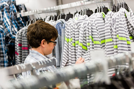 Teenager shopping for new clothes at the department stpre.の写真素材