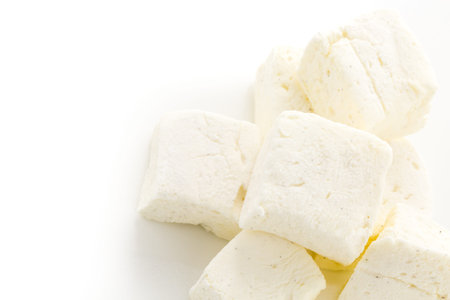 Homemade white vanilla bean marshmallows on a white backgrouns.の写真素材