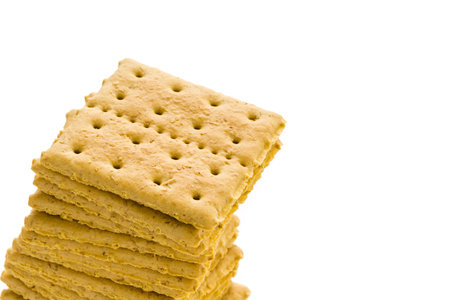 Stack of graham crackers on a white background.