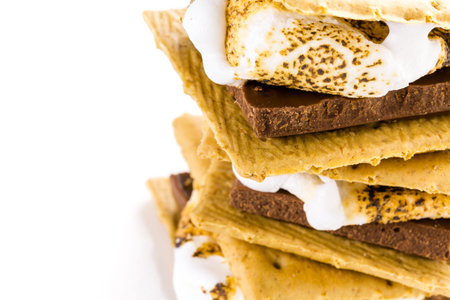 Freshly toasted smores with large white marshmallows.