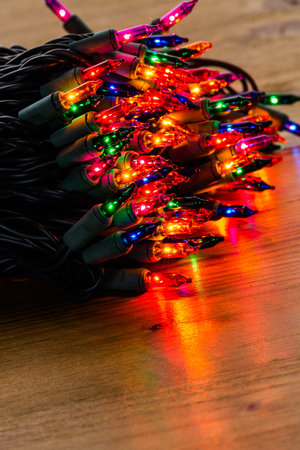 String of multicolor Christmas lights with green wiring.の写真素材