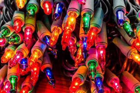 String of multicolor Christmas lights with green wiring.の写真素材