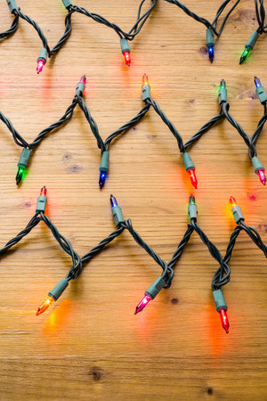 String of multicolor Christmas lights with green wiring.の写真素材