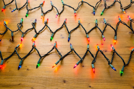 String of multicolor Christmas lights with green wiring.の写真素材