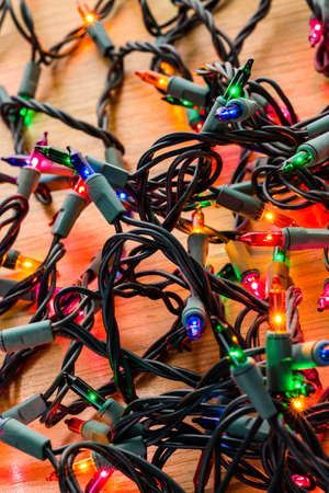 String of multicolor Christmas lights with green wiring.の写真素材