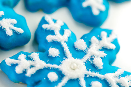 Frosted blue sugar cookies in shape of snowflakes.