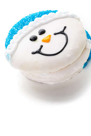 Frosted white sugar cookies in shape of snowman.の写真素材