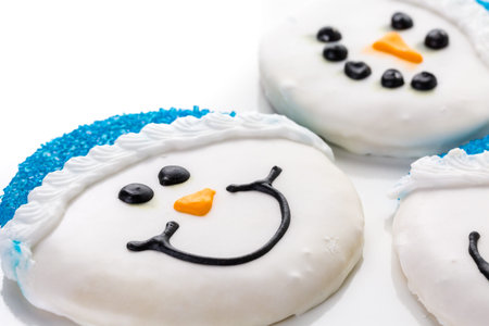 Frosted white sugar cookies in shape of snowman.の写真素材