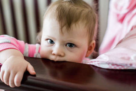 Cute toddler girl waking up from her nap.の写真素材