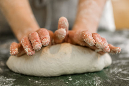 Young baker preparing artisan sourdough bread.の写真素材