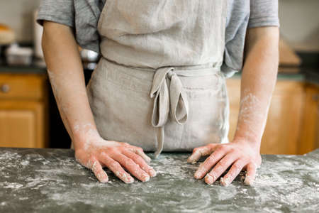 Young baker preparing artisan sourdough bread.の写真素材