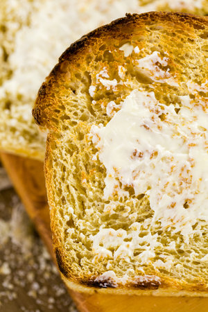 Toasted slices of freshly baked sourdough bread with butter.
