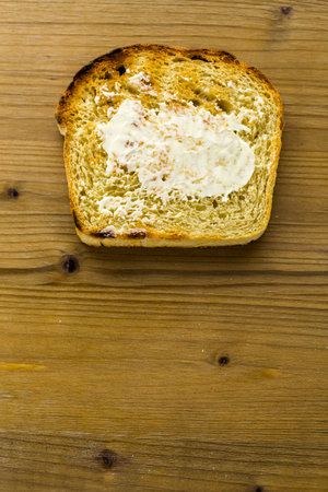 Toasted slices of freshly baked sourdough bread with butter.