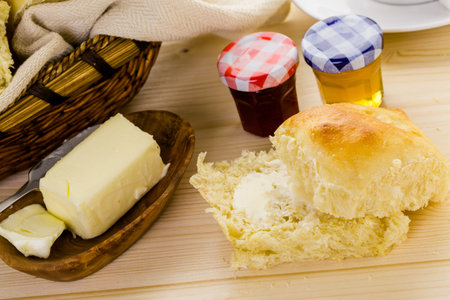 Freshly baked sourdough dinner rolls on the table.の写真素材