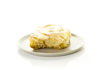 Freshly baked sourdough cinnamon rolls on a white background.の写真素材