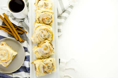 Freshly baked sourdough cinnamon rolls on a white background.の写真素材