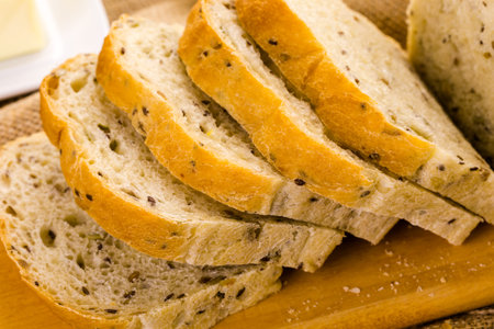 Fresh artisan sourdough seeded bread on the table.