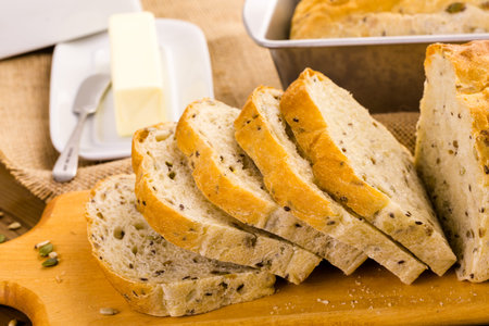 Fresh artisan sourdough seeded bread on the table.