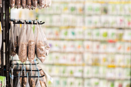 Variety of seeds on display in garden center.の写真素材