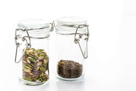 Dry seeds for baking bread in small glass jars.の写真素材