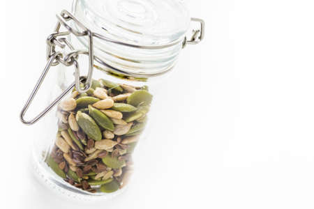 Dry seeds for baking bread in small glass jars.の写真素材