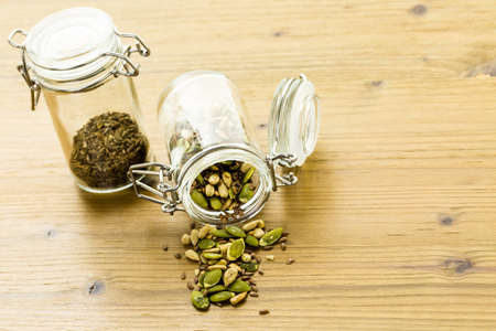 Dry seeds for baking bread in small glass jars.の写真素材