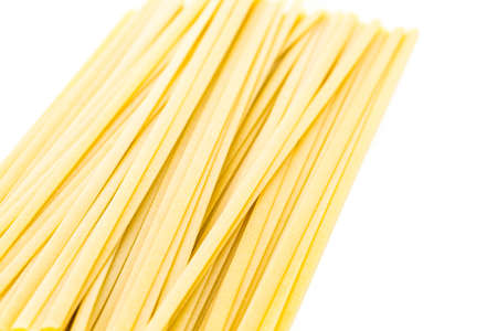 Organic dry pasta on a white background.の写真素材