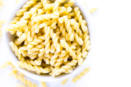 Organic dry pasta on a white background.の写真素材