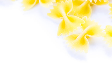 Organic dry pasta on a white background.