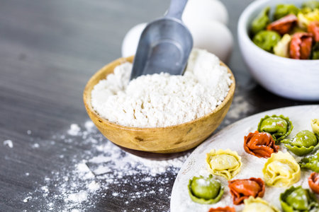 Making fresh rainbow cheese tortellini with organic produce.の写真素材