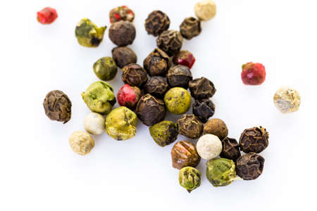 Bold and varied peppercorns on a white background.の写真素材