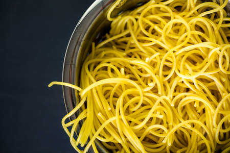 Cooking organic spaghetty for dinner.の写真素材