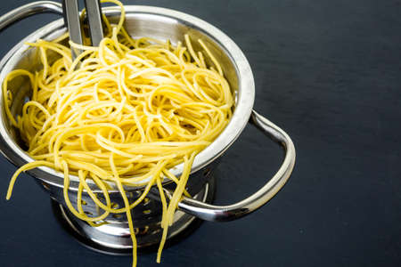 Cooking organic spaghetty for dinner.の写真素材