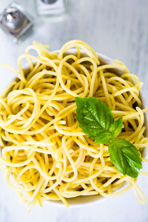 Simply coocked spaghetty in a white bowl.の写真素材