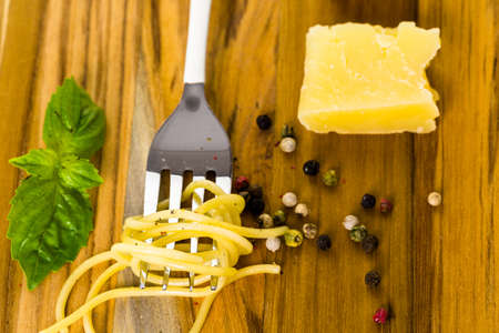 Ingredients for cheese and pepper pasta recipe on cutting board.の写真素材