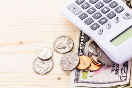 American bills and coins on the table.の写真素材