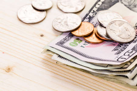 American bills and coins on the table.の写真素材