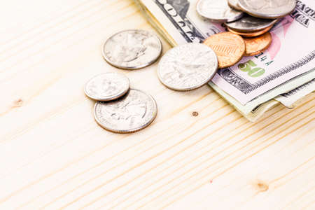 American bills and coins on the table.の写真素材