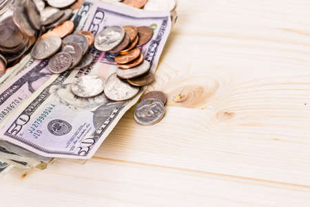 Saving money into glass jar for future investment.の写真素材