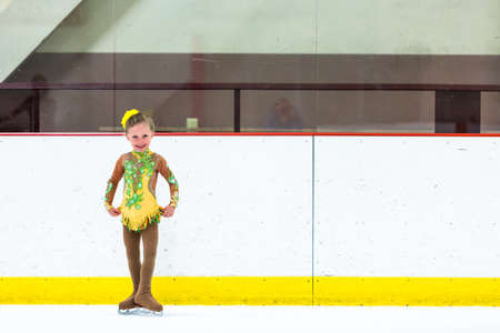 Cute girl practicing ice skating before her first competition.の写真素材