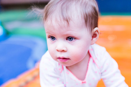 Toddler playing at the indoor toddler playground.