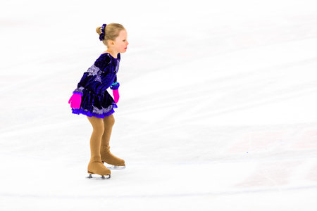 Young figure skater practicing before her first ccompetition.