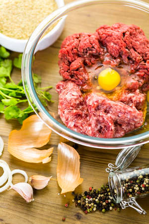 Ingredients for meatballs recipe on the table.の写真素材