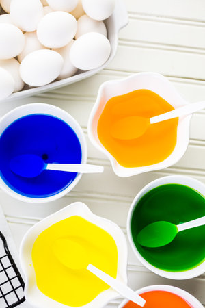 Painting eggs in pastel colors for Easter.