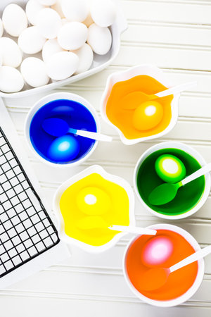 Painting eggs in pastel colors for Easter.