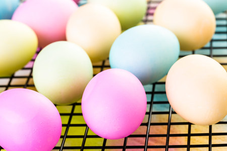 Painting eggs in pastel colors for Easter.